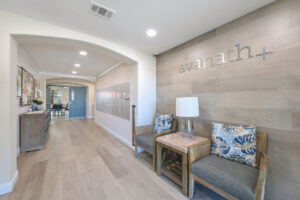 Interior Entrance Hallway, lounge chairs, interior signage, Community bulletin board, cluster mailbox units.